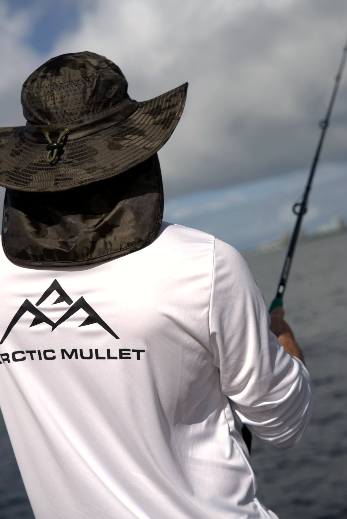 Fishing guide in a Green Camo Arctic Mullet hat
