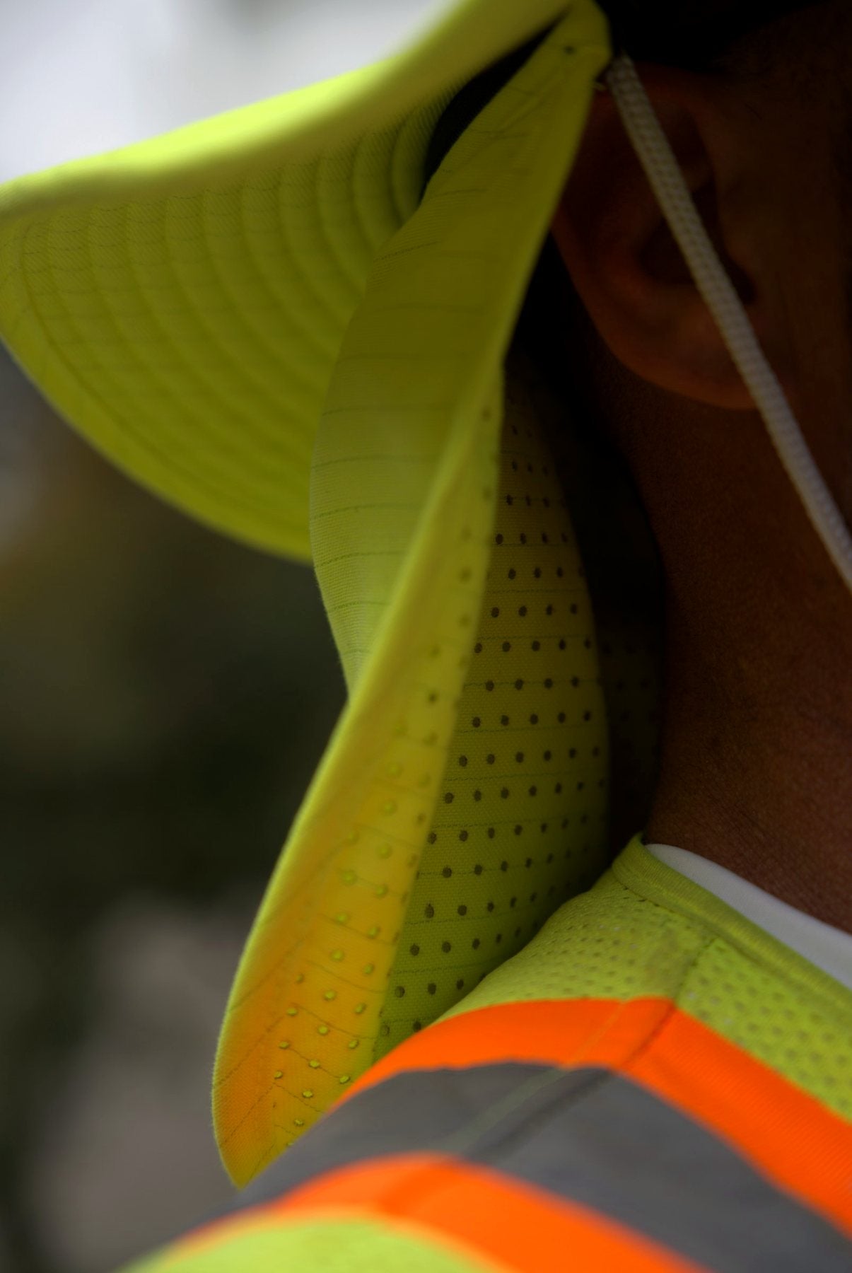 Close-up of the Safety Yellow Arctic Mullet hat brim and mesh